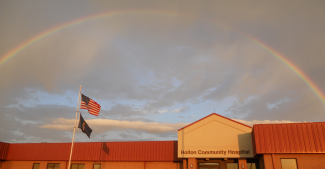 Rainbow over a hospital building